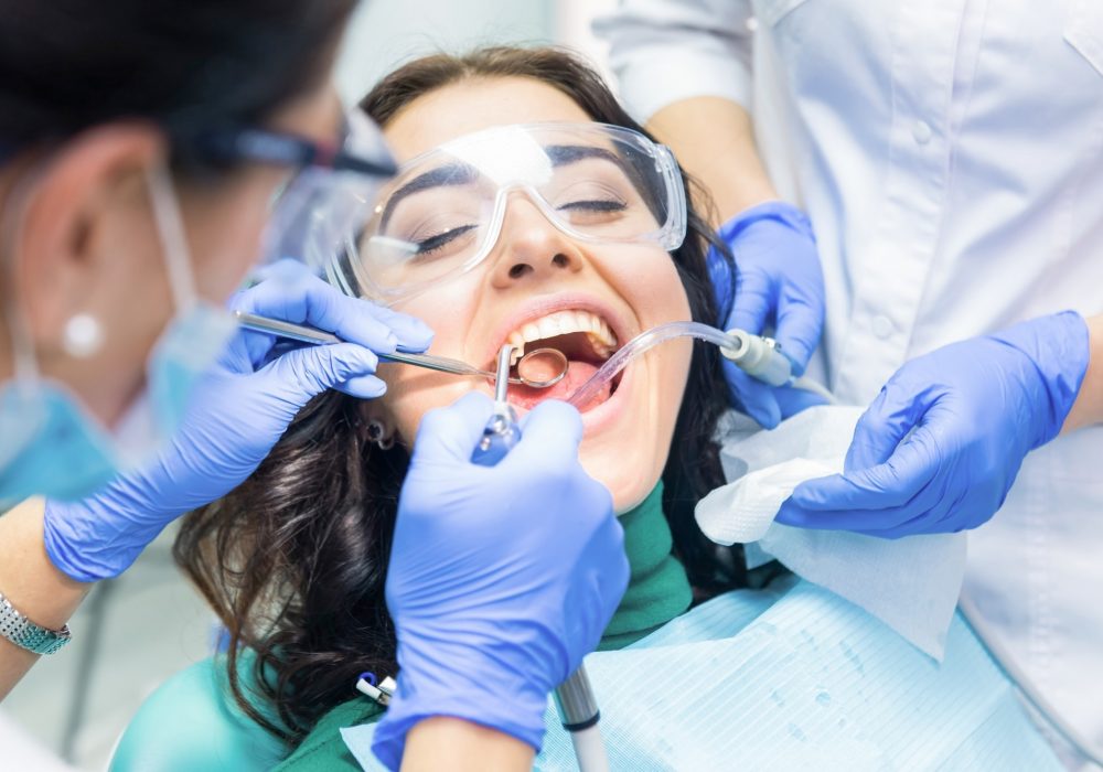 two-dentists-busy-with-patient.jpg